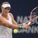 Stosur hits a return to Kvitova at the Rogers Cup tennis tournament in Toronto