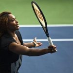 Williams of U.S. returns ball while she attends an exhibition game after Draw Ceremony before start of 2013 U.S. Open tennis tournament in New York