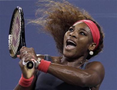 Serena Williams of the U.S. watches her backhand to Schiavone of Italy at the U.S. Open tennis championships in New York