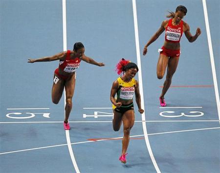 Fraser-Pryce of Jamaica celebrates winning the women's 100 metres final during the IAAF World Athletics Championships in Moscow