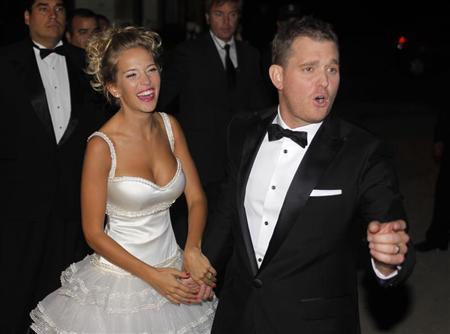 Canadian singer Buble and his bride Argentine actress Lopilato pose for photographers after their religious wedding ceremony in Marcos Paz