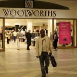 A man leaves a Woolworths shop in Sandton