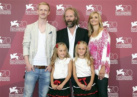 Director Groning poses with actors Zimmerschied, Finder, Pia Kleemann and Chiara Kleemann during a photocall for the movie "The Police Officer's Wife" during the 70th Venice Film Festival in Venice