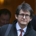 The editor of The Guardian Rusbridger leaves Downing Street in London