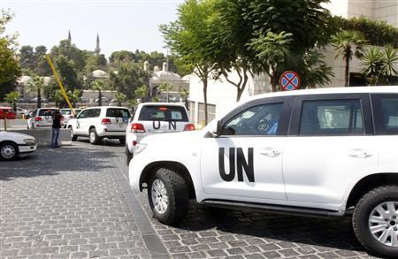 U.N. vehicles transport a team of U.N. chemical weapons experts to the scene of a poison gas attack outside the Syrian capital last week, in Damascus