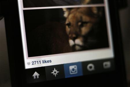 The number of likes on an Instagram photo are pictured on a mobile device screen in Pasadena