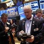 Traders work on the floor of the New York Stock Exchange