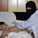 A youth, affected by what activists say is nerve gas, is treated at a hospital in the Duma neighbourhood of Damascus
