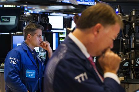 Traders work on the floor of the New York Stock Exchange shortly before the closing of the market in New York