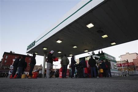 Customers wait in line at a Hess fueling station in Brooklyn, New York