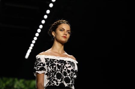 A model presents a creation from Naeem Khan Spring/Summer 2014 collection during New York Fashion Week