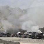 Smoke rises from burning NATO supply trucks after a Taliban attack at Torkham district