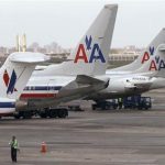 American Airlines aircraft sit on the tarmac at LaGuardia airport following a reservation system outage in New York