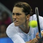 Petkovic of Germany hits return against Azarenka of Belarus at the China Open tennis tournament in Beijing