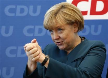 Hesse's Prime Minister Bouffier Geman Chancellor Merkel gestures before CDU party board meeting in Berlin