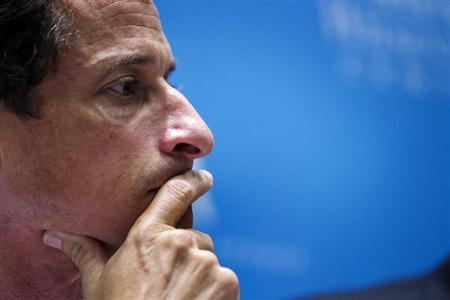 Weiner listens to fellow candidates speak at a debate held at the Museum of Tolerance in New York