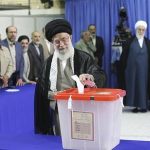 Iran's Supreme Leader Ayatollah Ali Khamenei casts his ballot at his office in central Tehran