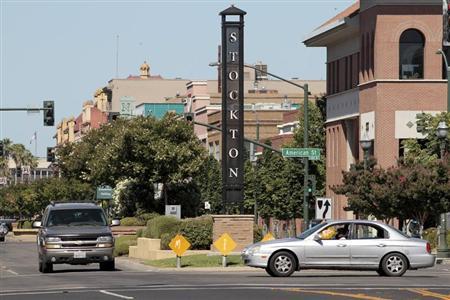 Traffic moves through downtown in Stockton, California which will become the largest U.S. city to file for bankruptcy.