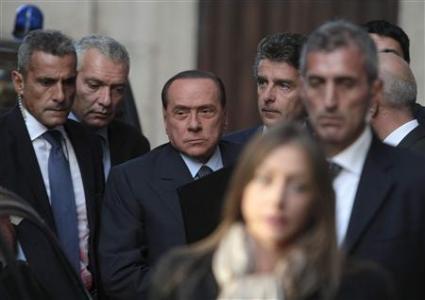Italy's former PM Berlusconi arrives at the lower house of parliament in Rome