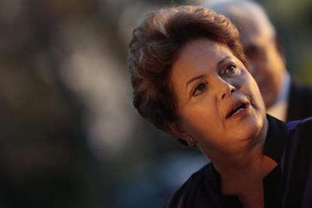 Brazil's President Dilma Rousseff reacts during a reception for the Brazilian Football delegation at the Alvorada Palace in Brasilia