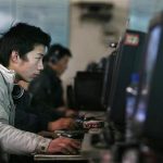Chinese internet users go online at an internet shop in Beijing