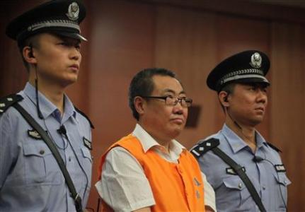 Yang Dacai, a former provincial official, listens to a verdict at a court in Xi'an, Shaanxi province