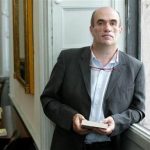 Irish author Colm Toibin poses for photographers after he won the world's richest literary prize for..
