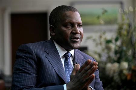 Founder and Chief Executive of the Dangote Group Aliko Dangote gestures during an interview with Reuters in his office in Lagos