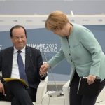 German Chancellor Merkel and French President Hollande attend a meeting with business leaders in St.Petersburg