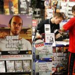 Game enthusiasts purchase the latest release of "Grand Theft Auto Five" after the game went on sale at the Game Stop store in Encinitas, California
