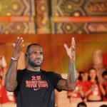 NBA basketball player James of the Miami Heat gestures as he attends a promotional event in Beijing
