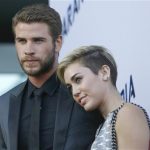 Hemsworth poses with Cyrus at premiere of "Paranoia" in Los Angeles