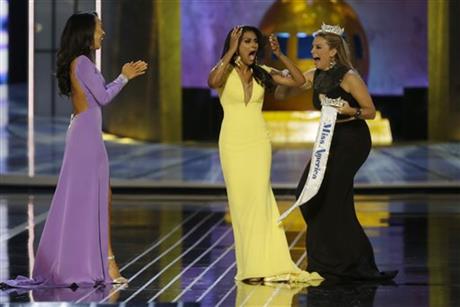 Miss New York Nina Davuluri, center, reacts after being named Miss America 2014