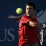 Djokovic of Serbia hits a return to Granollers of Spain at the U.S. Open tennis championships in New York