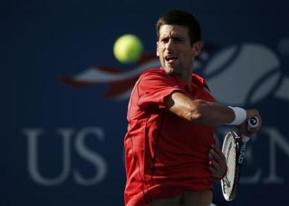 Djokovic of Serbia hits a return to Granollers of Spain at the U.S. Open tennis championships in New York