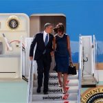 President Barack Obama, accompanied by first lady Michelle Obama