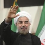 Iranian President-elect Hassan Rohani gestures to the media during a news conference in Tehran