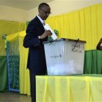 Rwanda's President Paul Kagame casts his vote during a parliamentary election in the capital Kigali
