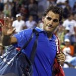 Federer of Switzerland waves as he walks off the court after losing in three sets to Robredo of Spain at the U.S. Open tennis championships in New York
