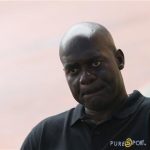 Sprinter Ben Johnson of Canada talks with his colleagues during his visit to the track at the Seoul Olympic Stadium in Seoul