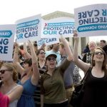 Supporters of the Affordable Healthcare Act celebrate after the court upheld the legality of the law in Washington