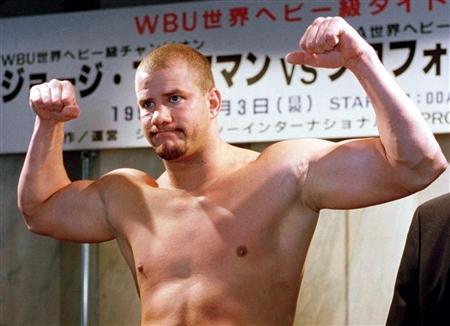 HIV infected heavyweight boxer and former WBO champion Tommy Morrison of the United States poses during a weigh-in in Tokyo in this file photo