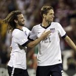 United States' Beckerman and Goodson celebrate their victory over Mexico in their 2014 World Cup qualifying soccer match in Columbus