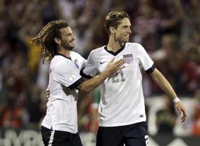 United States' Beckerman and Goodson celebrate their victory over Mexico in their 2014 World Cup qualifying soccer match in Columbus