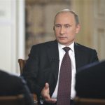 Russian President Putin speaks during an interview at the Novo-Ogaryovo state residence outside Moscow