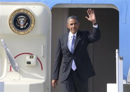 U.S. President Barack Obama waves as he arrives to take part in the G20 Summit in St. Petersburg