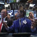 Traders work on the floor of the New York Stock Exchange