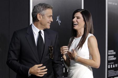 Actors George Clooney and Sandra Bullock arrive for the film premiere of "Gravity" in New York