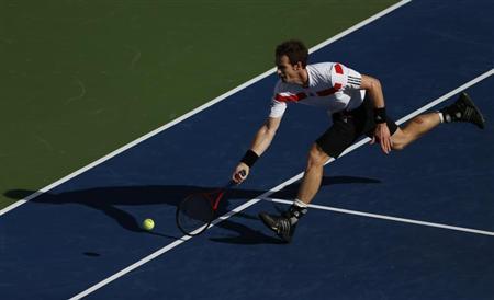 Murray of Britain chases down a return to Wawrinka of Switzerland at the U.S. Open tennis championships in New York