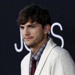 Ashton Kutcher poses at the premiere of "Jobs" in Los Angeles